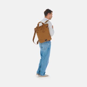 man standing wearing weathergoods city bikepack toffee bicycle bag as backpack